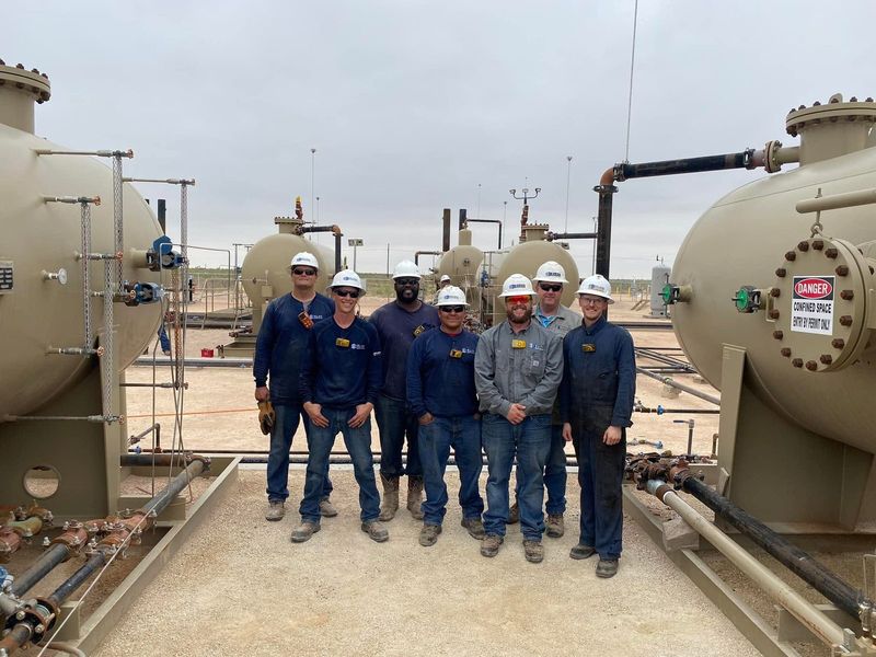 The Elite crew on a heater treater location