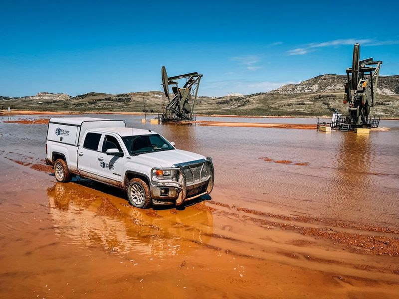 Elite service truck on a wet location with pumpjacks